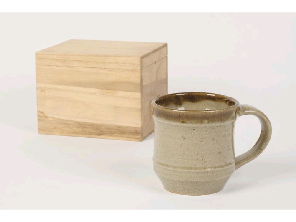 Appraisal: SHOJI HAMADA A STONEWARE MUG with pale green glaze in