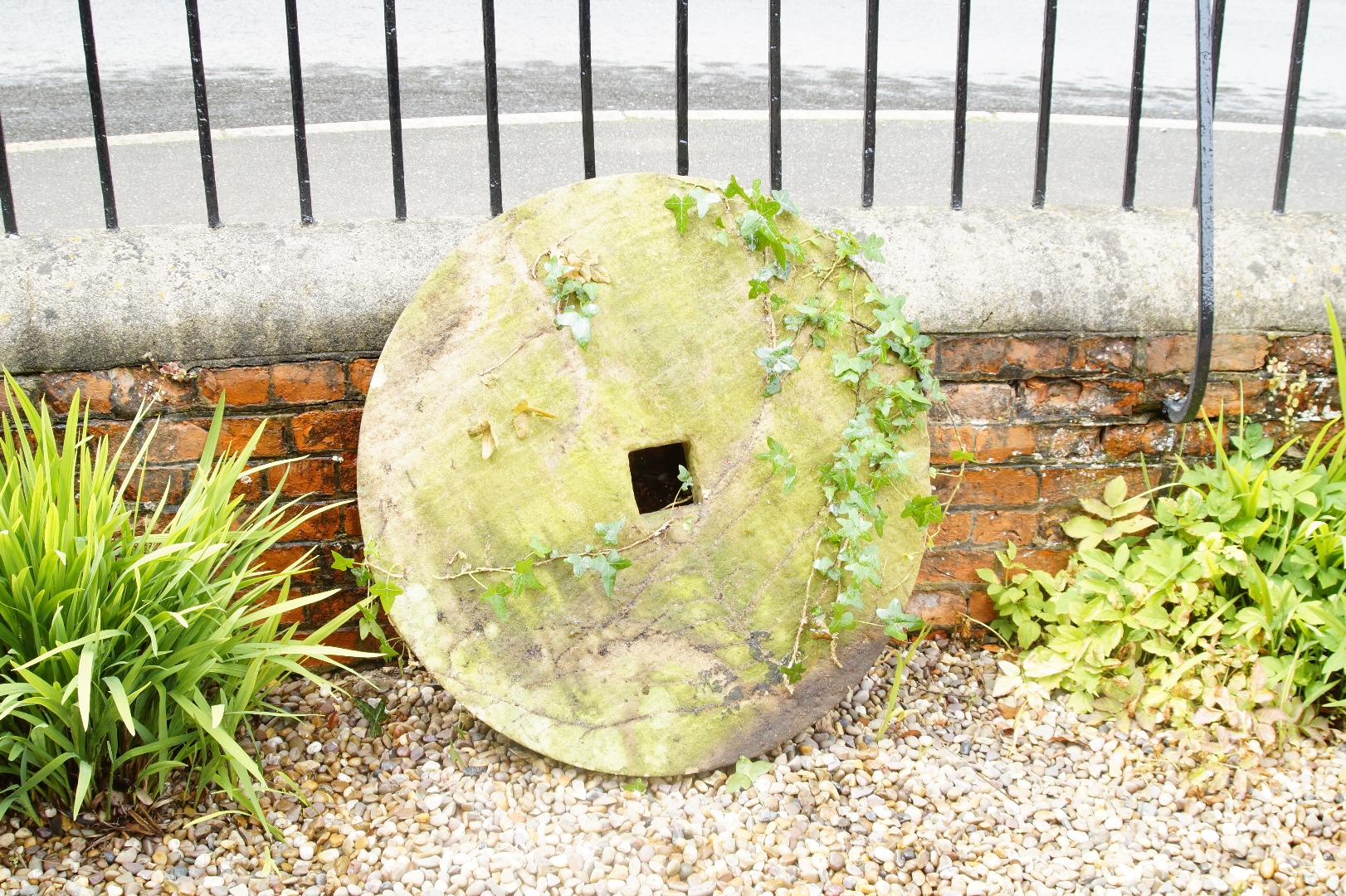 Appraisal: A hand hewn millstone circa cm dia