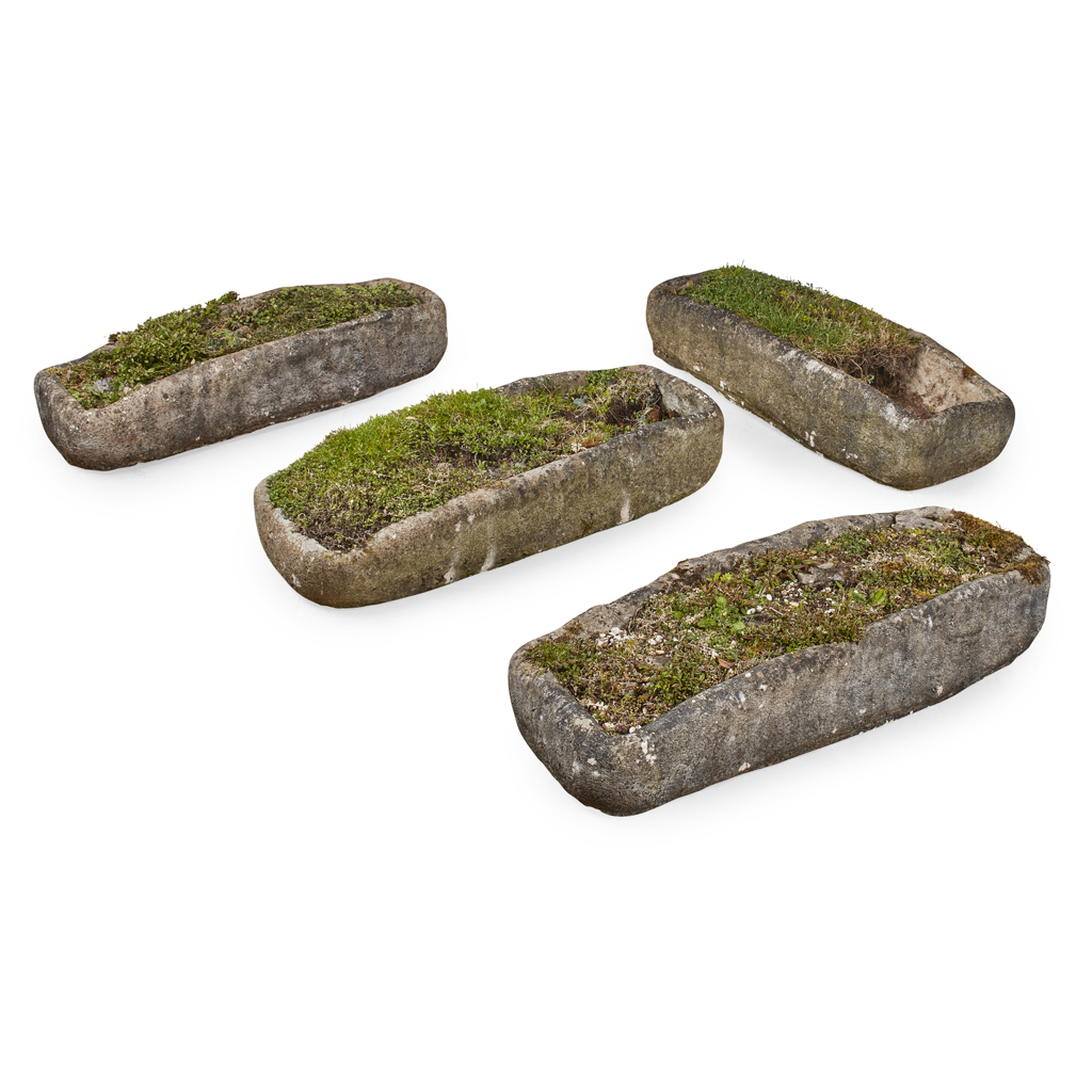 Appraisal: FOUR STONE TROUGHS of rough and irregular rectangular shape and