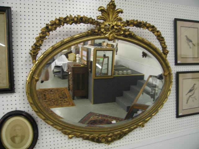 Appraisal: th Century Carved Gilt Oval Mirror bow garland decor a