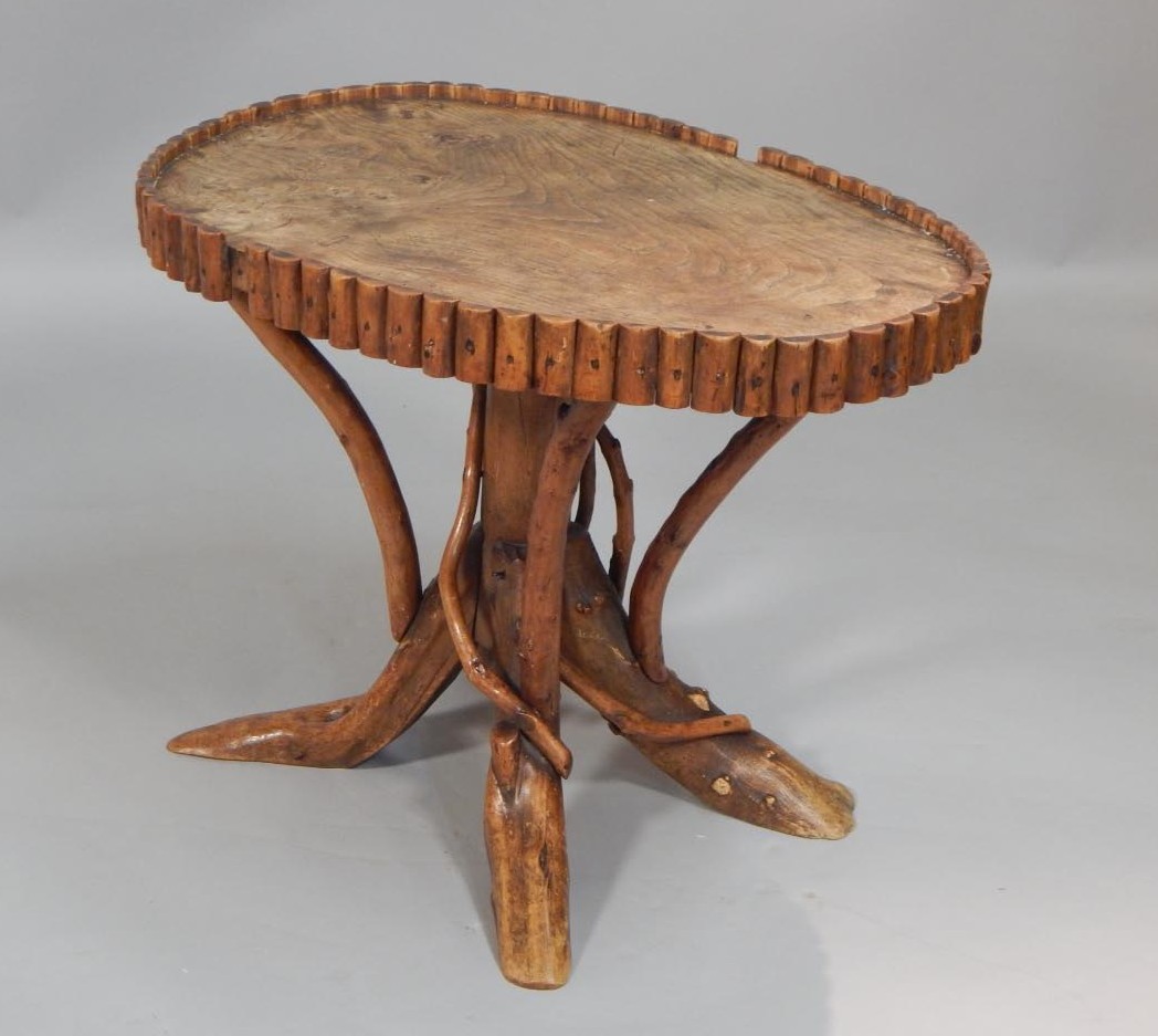 Appraisal: An unusual thC elm grotto type table the oval top