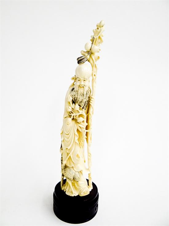 Appraisal: CARVED IVORY FIGURE China early th century God of Longevity