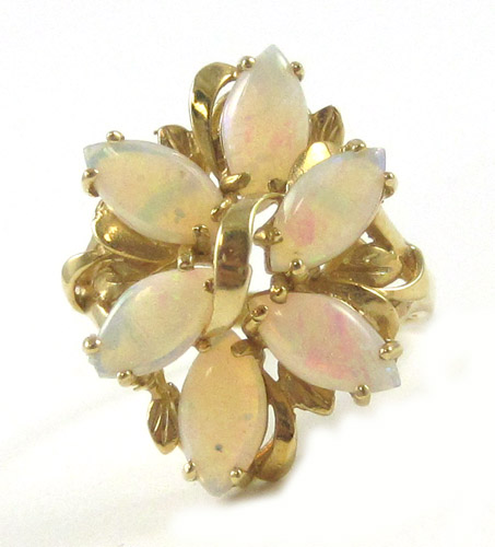 Appraisal: OPAL AND FOURTEEN KARAT GOLD RING set with a cluster