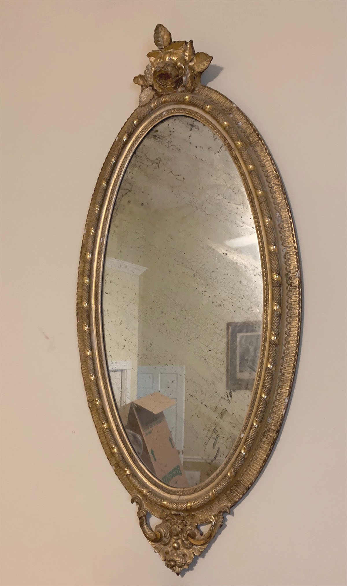 Appraisal: ROSE CRESTED GILT PARLOR MIRROR Gilt parlor mirror having a