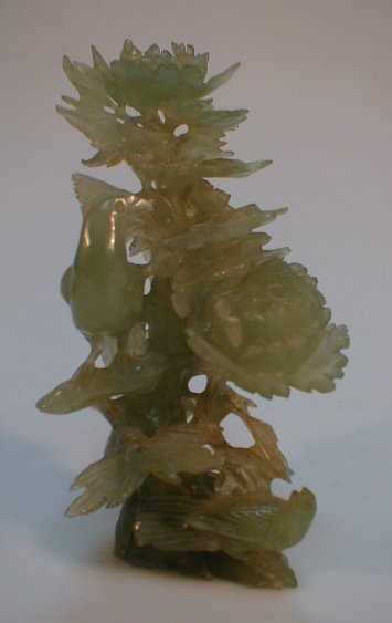 Appraisal: A jade carving of chrysanthemums and bird as found