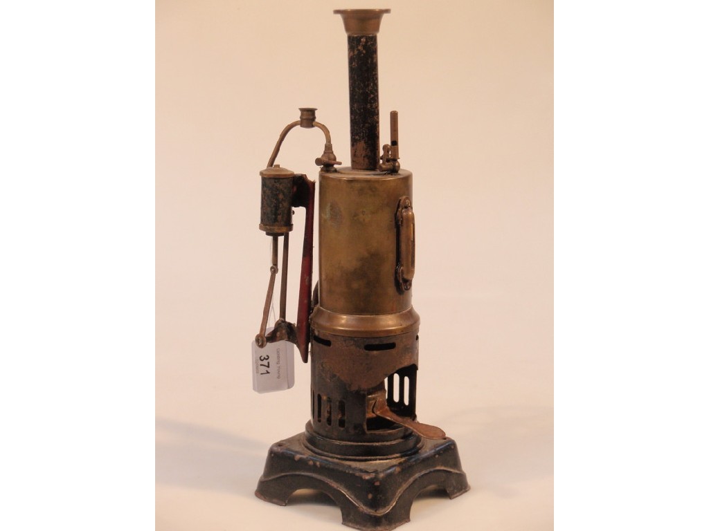 Appraisal: A brass and black tin stationary steam engine cm high