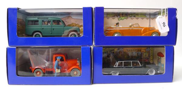 Appraisal: FOUR EN VOITURE TINTIN FIGURES FROM TINTIN COMICS RELEASED IN