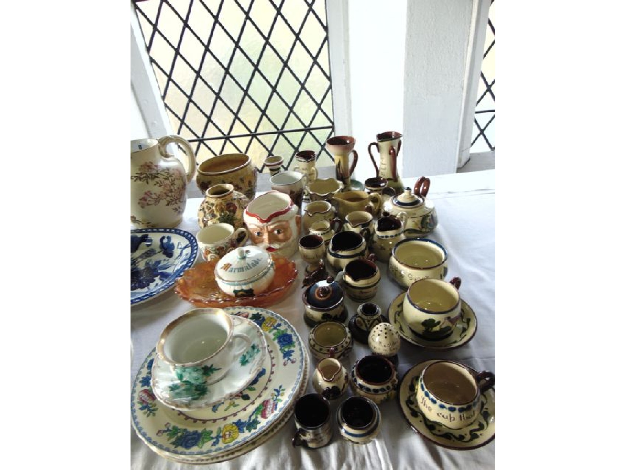 Appraisal: A quantity of Torquay wares including two three handled vases