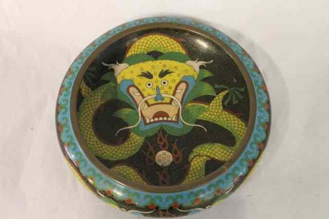 Appraisal: A CHINESE BLACK GROUND CLOISONNE BOWL with central stylised dragon