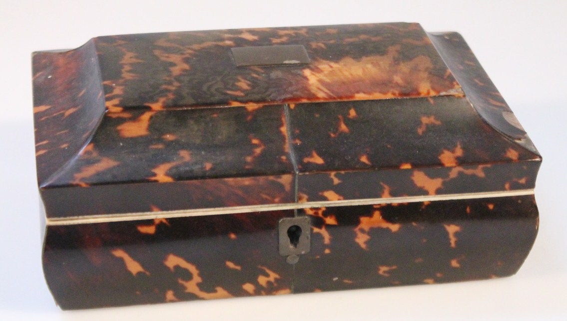 Appraisal: A thC tortoiseshell casket the rectangular domed top centred by