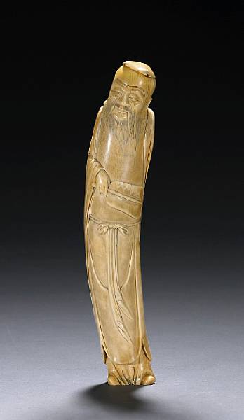 Appraisal: A carved ivory figure of a sage th Century Carved