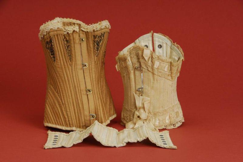 Appraisal: Lot Three Doll Corsets Lot includes three commercially made doll