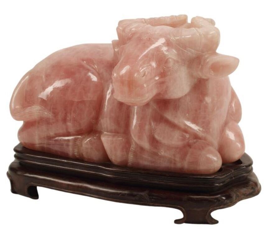 Appraisal: Large carved rose quartz figure of a buffalo on wood