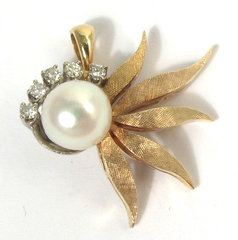 Appraisal: PEARL DIAMOND FOURTEEN GOLD PENDANT set with a round white