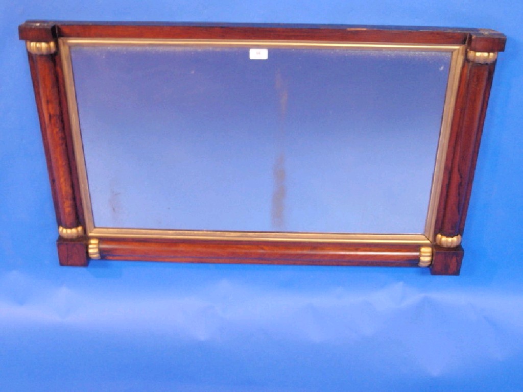 Appraisal: A Victorian rosewood and gilt overmantel mirror with column frame