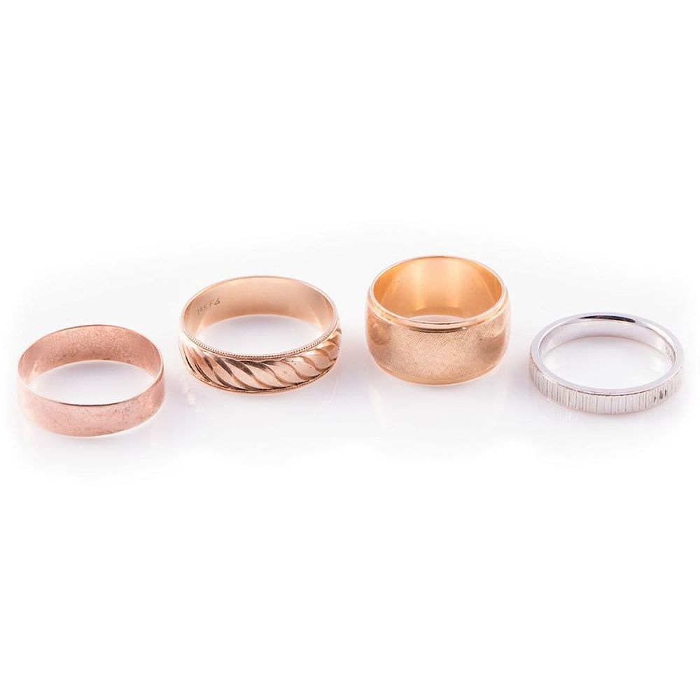 Appraisal: Four k gold wedding bands in rose white and yellow