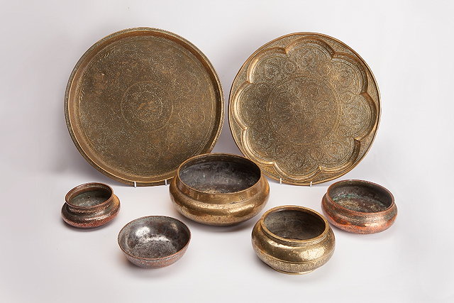 Appraisal: A COLLECTION OF SEVEN PIECES OF INDO-PERSIAN METALWARE TO INCLUDE