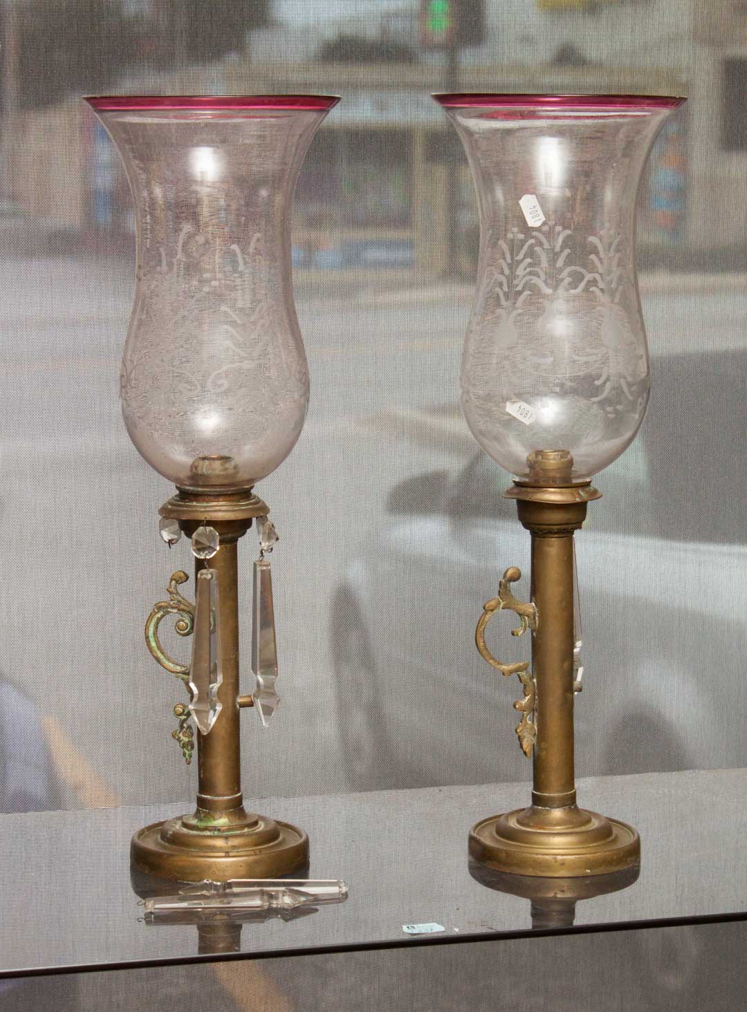 Appraisal: Pair of brass candlesticks with etched shades