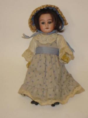 Appraisal: An Armand Marseille bisque head girl doll with fixed blue