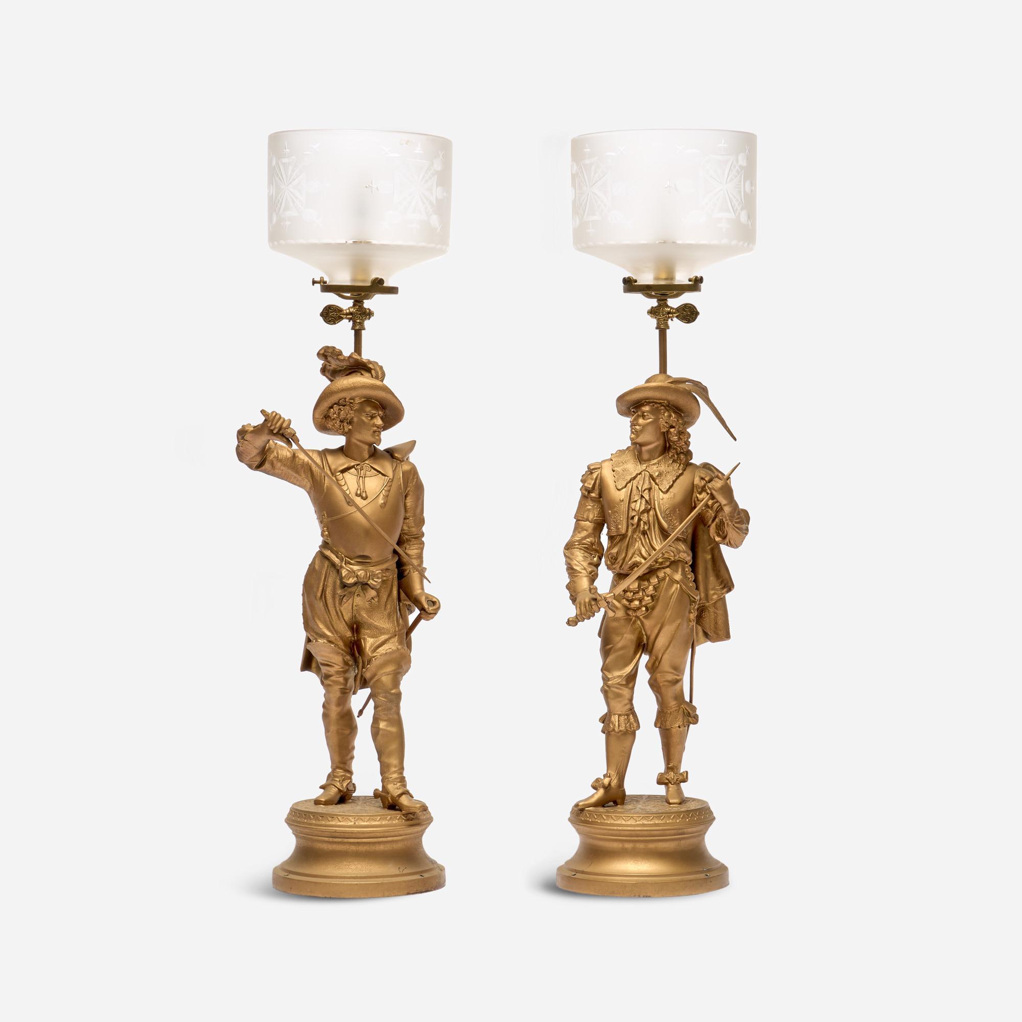 Appraisal: VINTAGE PAIR OF FIGURAL MUSKETEER LAMPS A vintage pair of