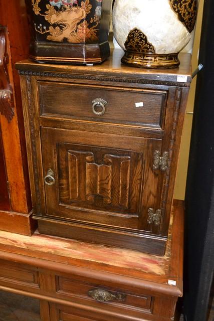 Appraisal: TUDOR STYLE OAK DRINKS TROLLEY AND A SIMILAR SIDE CUPBOARD