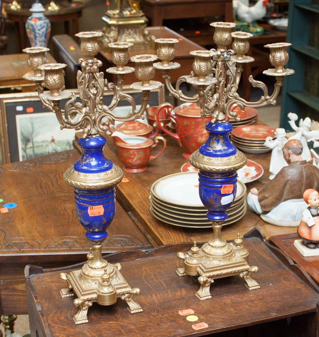 Appraisal: Pair of gilt-metal and cobalt porcelain candelabra