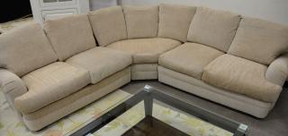 Appraisal: Tan upholstered sectional sofa and matching club chair sofa lg