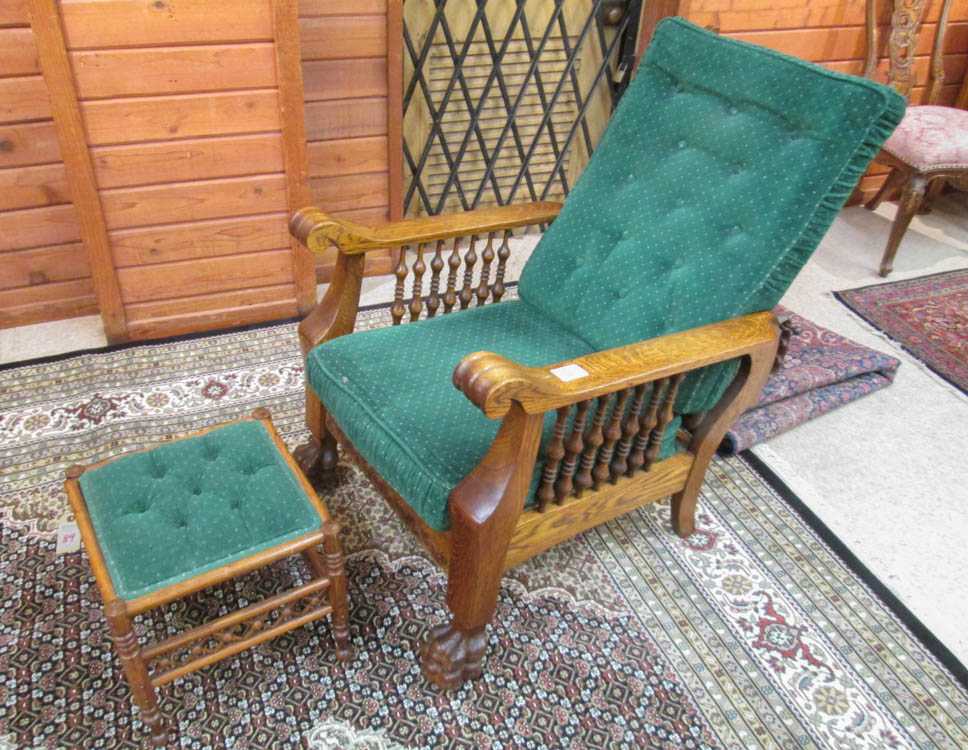 Appraisal: AN OAK 'MORRIS' ARMCHAIR WITH FOOTSTOOL American c with green