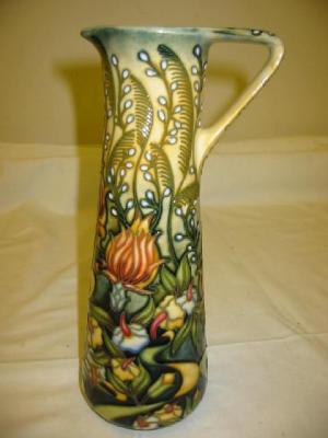 Appraisal: A MOORCROFT POTTERY EWER of tapering cylindrical form tube lined