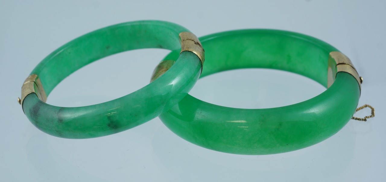 Appraisal: Pr green stone hinged bangle bracelets catches stamped K GP