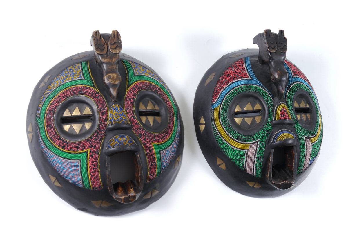 Appraisal: PAIR OF CARVED AND BEADED AFRICAN MASKS Baluba tribe Ghana