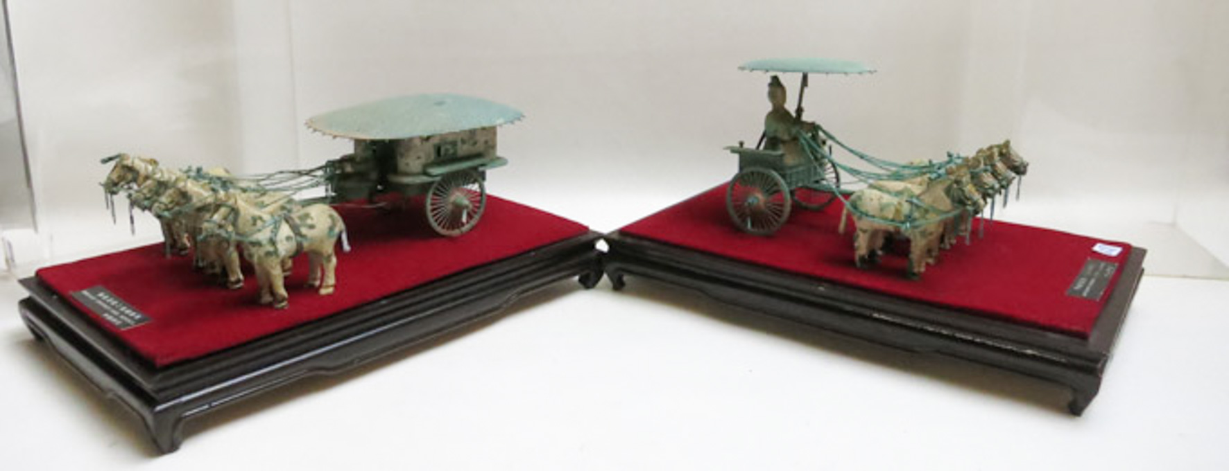 Appraisal: TWO CHINESE CASED MODELS OF CHARRIOT AND HORSES each model