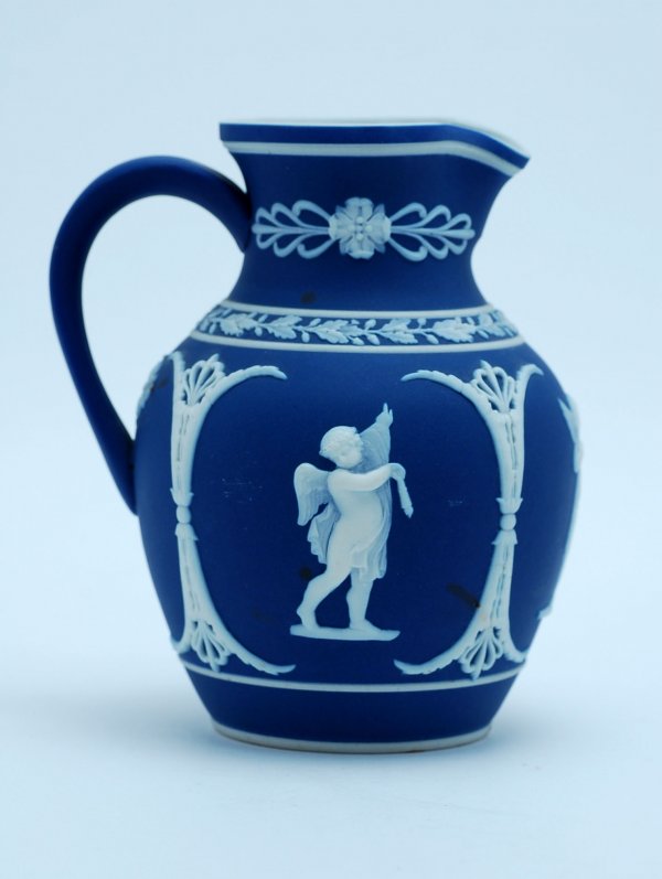 Appraisal: th century jasperware milk pitcher with raised white pattern of