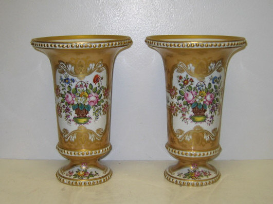 Appraisal: PAIR CONTINENTAL PORCELAIN VASES French Empire style footed urn form