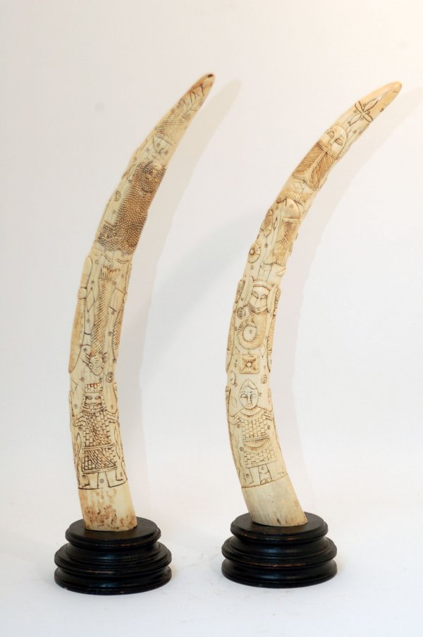 Appraisal: A pair of Benin carved ivory tusks th century depicting