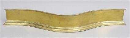 Appraisal: ENGLISH BRASS SERPENTINE-FRONTED FENDER With applied upper rim and molded