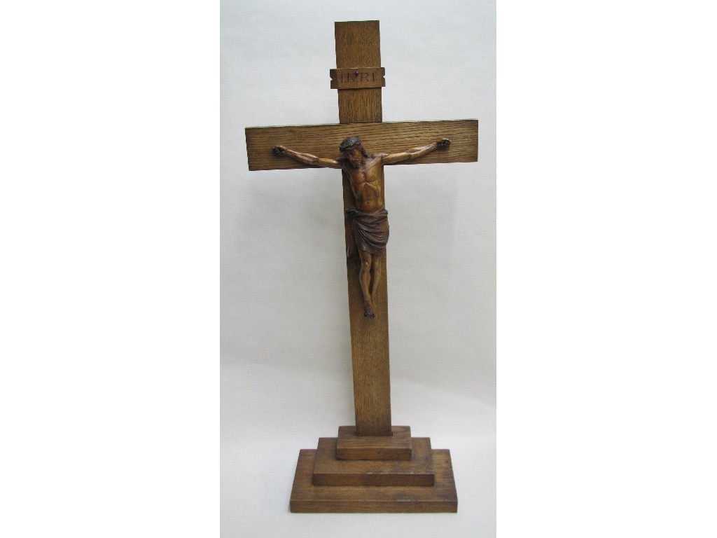 Appraisal: An oak and boxwood crucifix with Christ beneath the letters