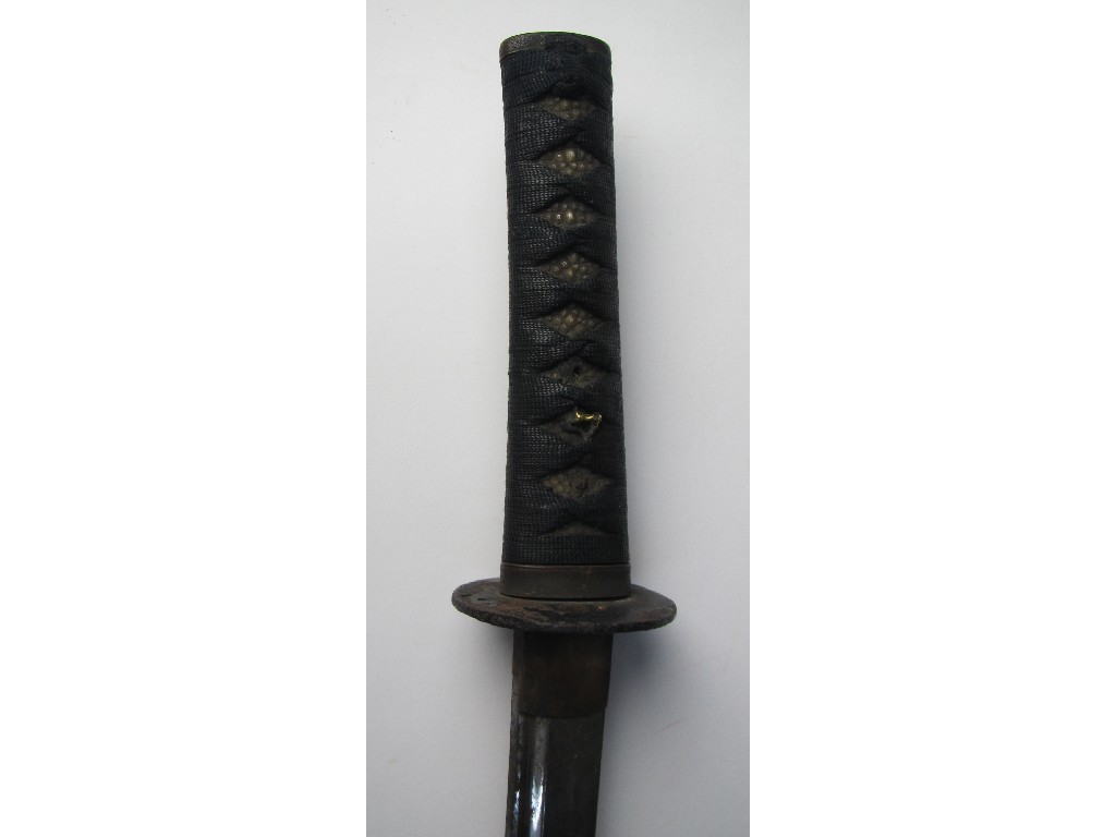 Appraisal: A Japanese wakasashi with shagreen and bound handle iron tsuba