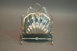 Appraisal: A Victorian shell form biscuit sachet complete with pierced liner