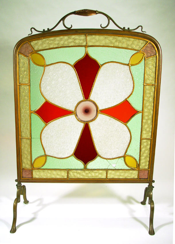 Appraisal: Art Nouveau style brass firescreen with stained and moulded glass