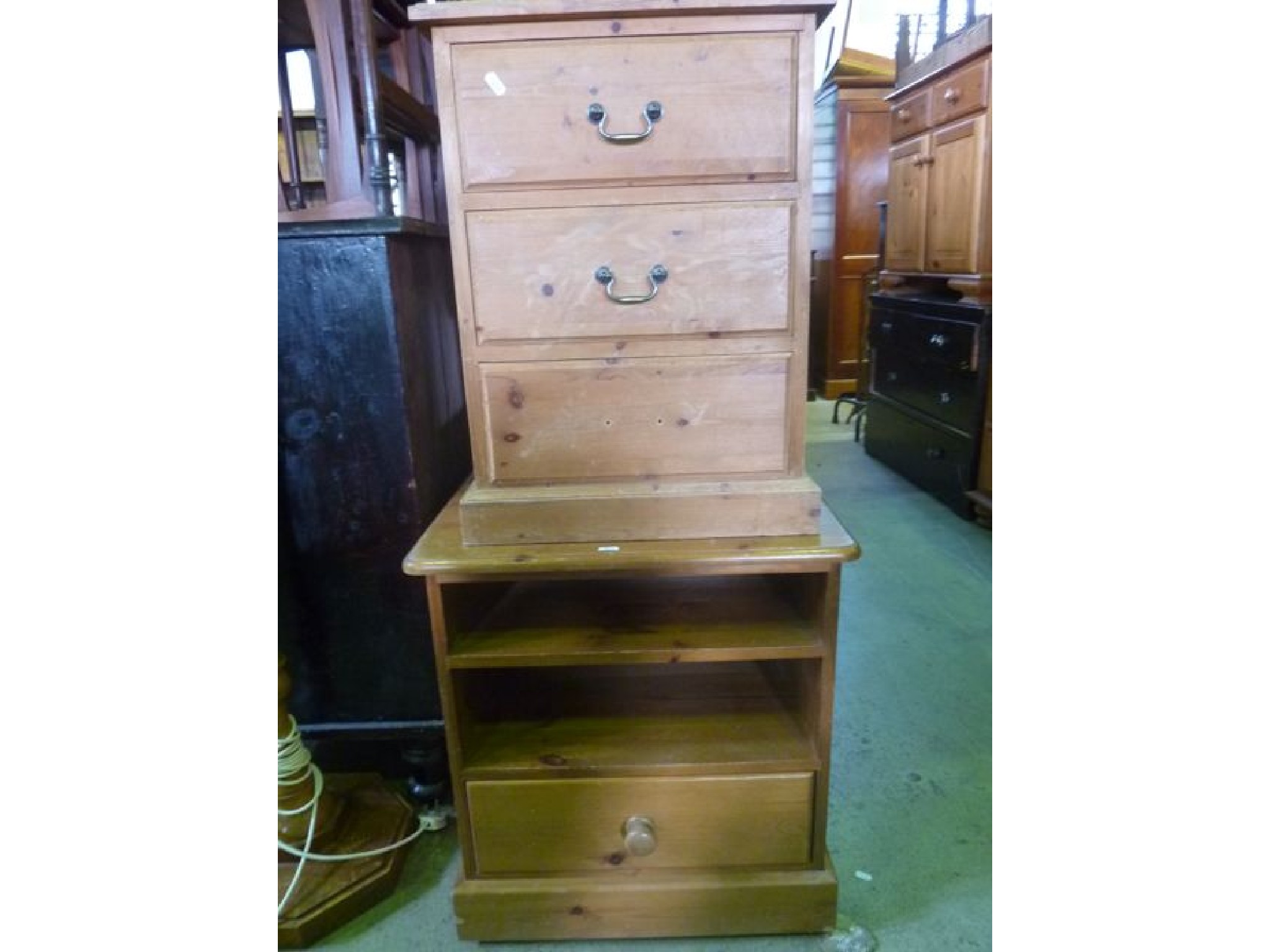 Appraisal: A small stripped pine three drawer pedestal chest together with