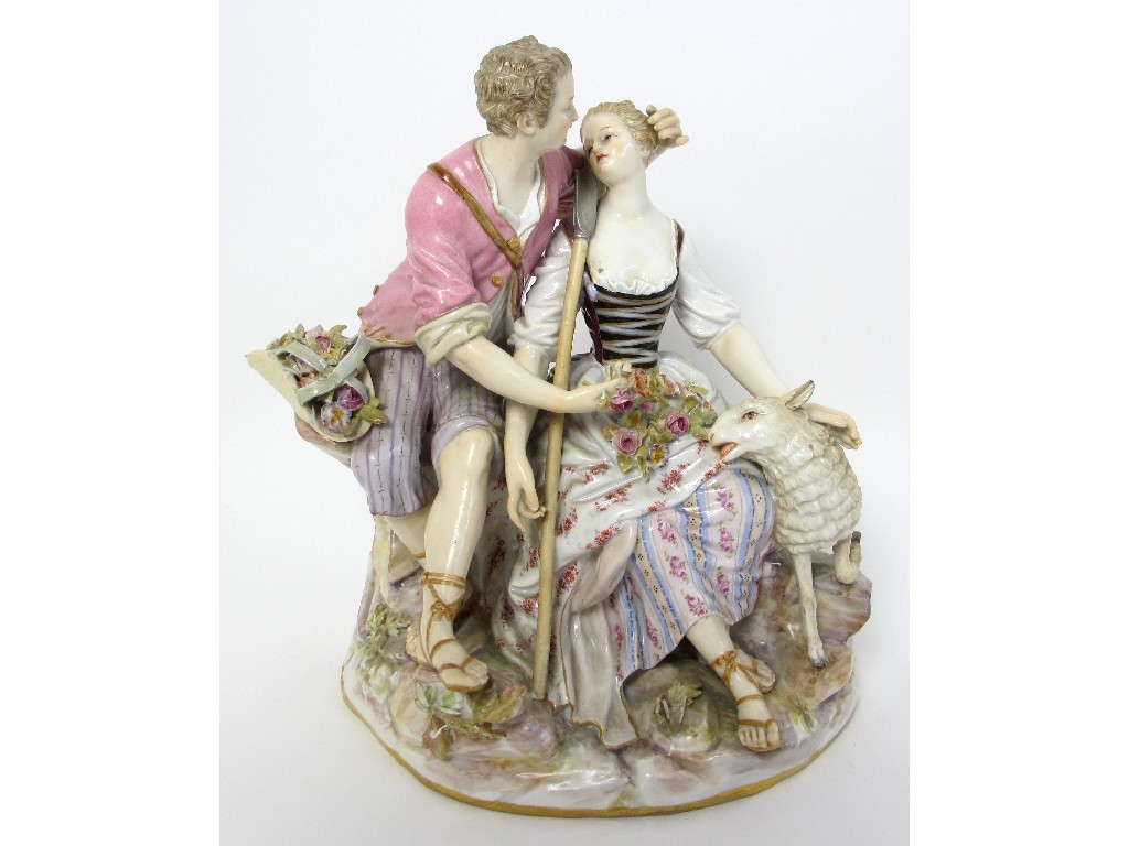 Appraisal: A Meissen group of a courting couple seated on rockwork