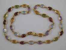 Appraisal: An carat gold multi gem ''tutti frutti'' necklace approx cm