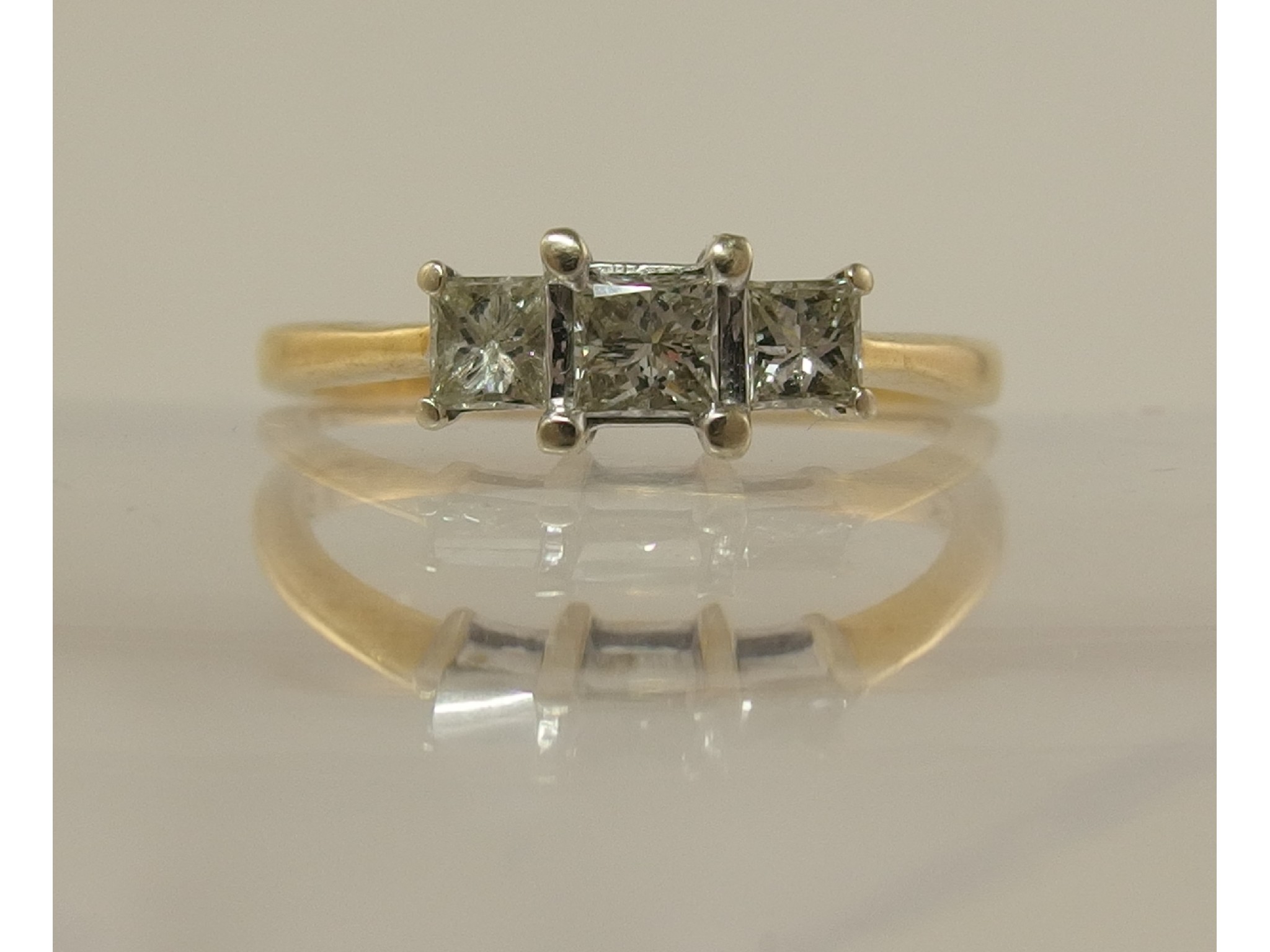 Appraisal: An ct gold three stone princess cut diamond ring of