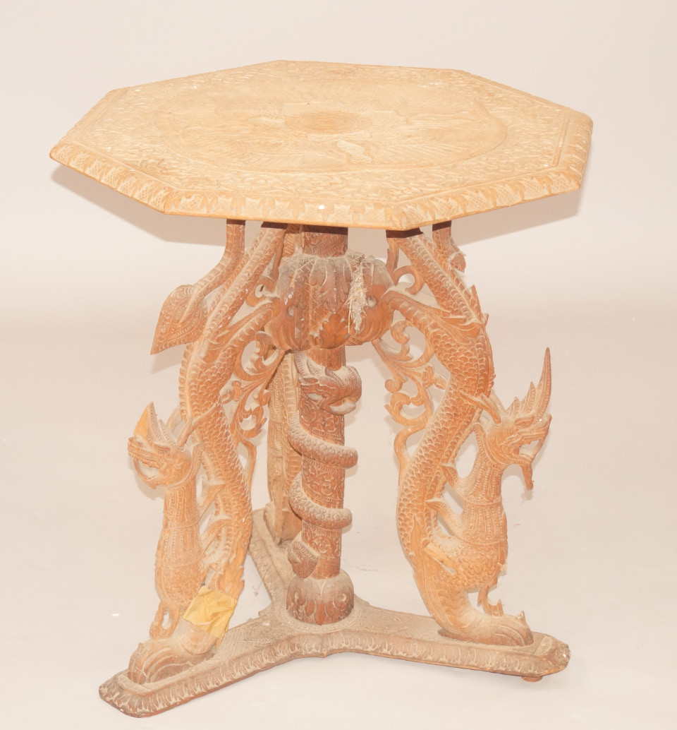 Appraisal: An Eastern carved wood occasional table octagonal top decorated with