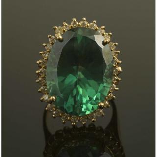 Appraisal: Teal Topaz Diamond Gold Ring An irradiated teal topaz ring