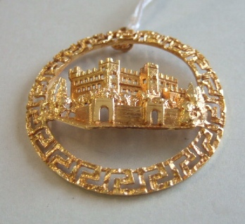 Appraisal: An Eastern gold pendant depicting a castle view within a