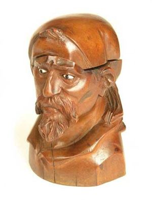 Appraisal: A th century carved treen inkwell modelled as the head