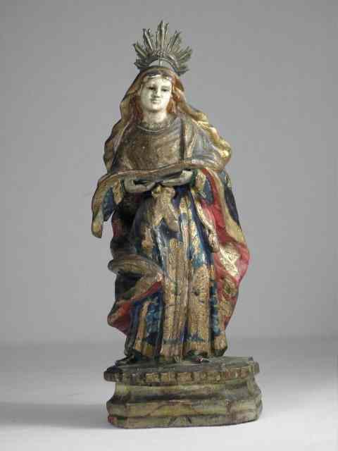 Appraisal: Carved wood santos Polychrome painted wood figure with cut metal