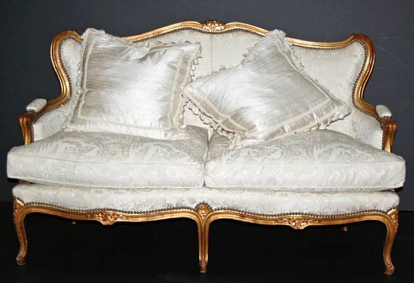 Appraisal: A Louis XV style carved and giltwood small canape height